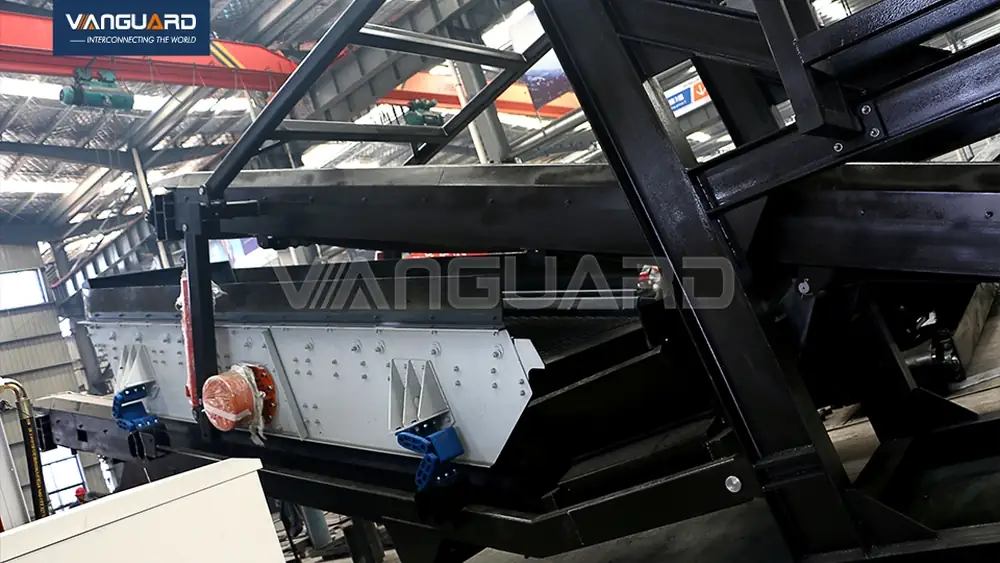 Close-up of crusher eccentric shaft and screen mesh